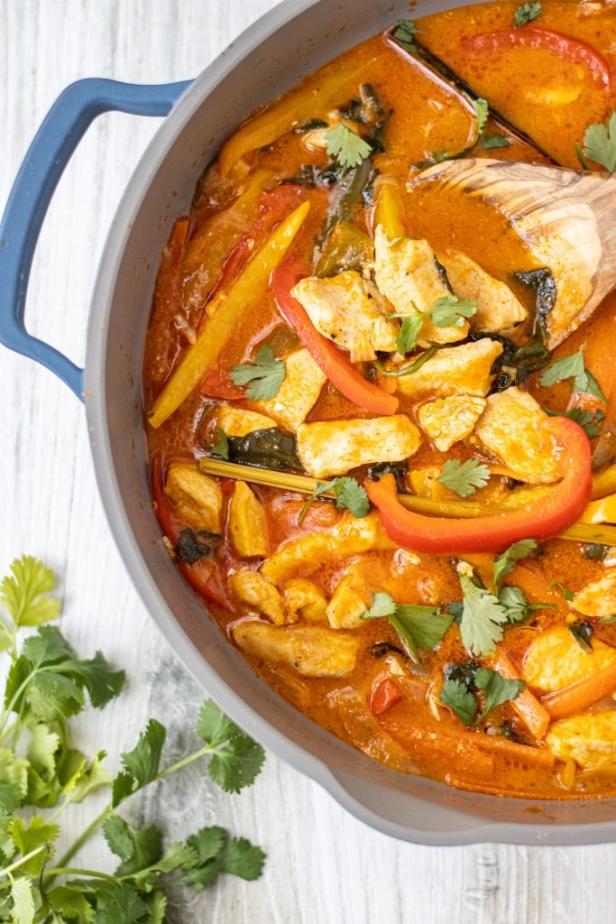 Pan with Thai Lemongrass Curry with peppers, chicken. Cilantro garnish